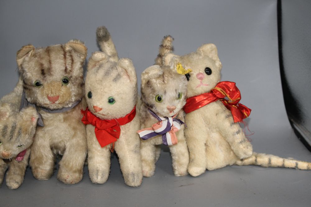 A collection of assorted soft toy cats